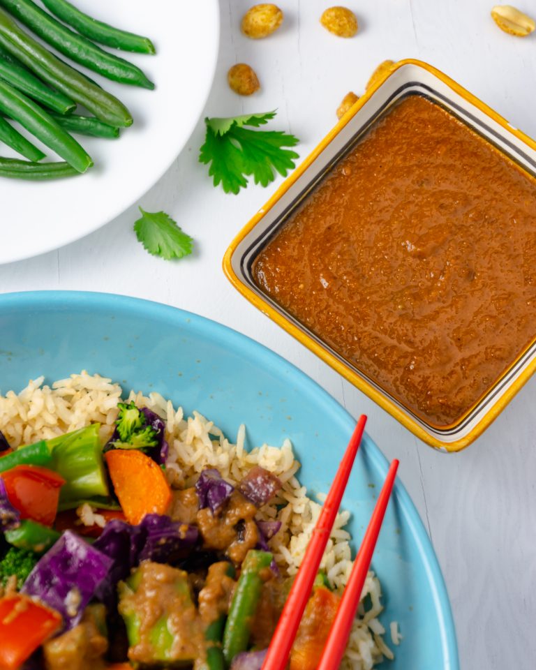 thai peanut stir-fry sauce with veggies and rice